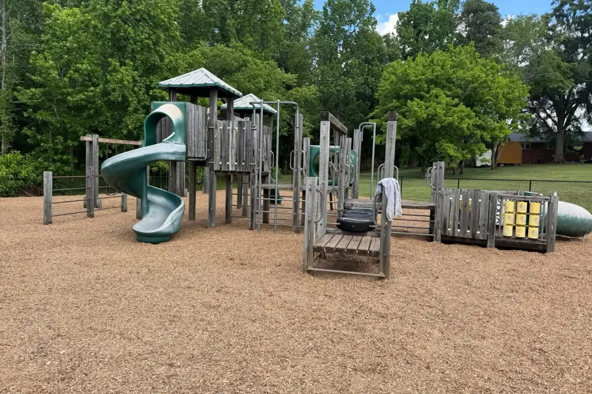 Fresh mulch spread beneath playground equipment
