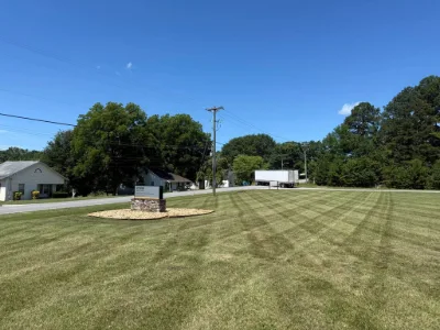 Mowed commercial lot with a sign